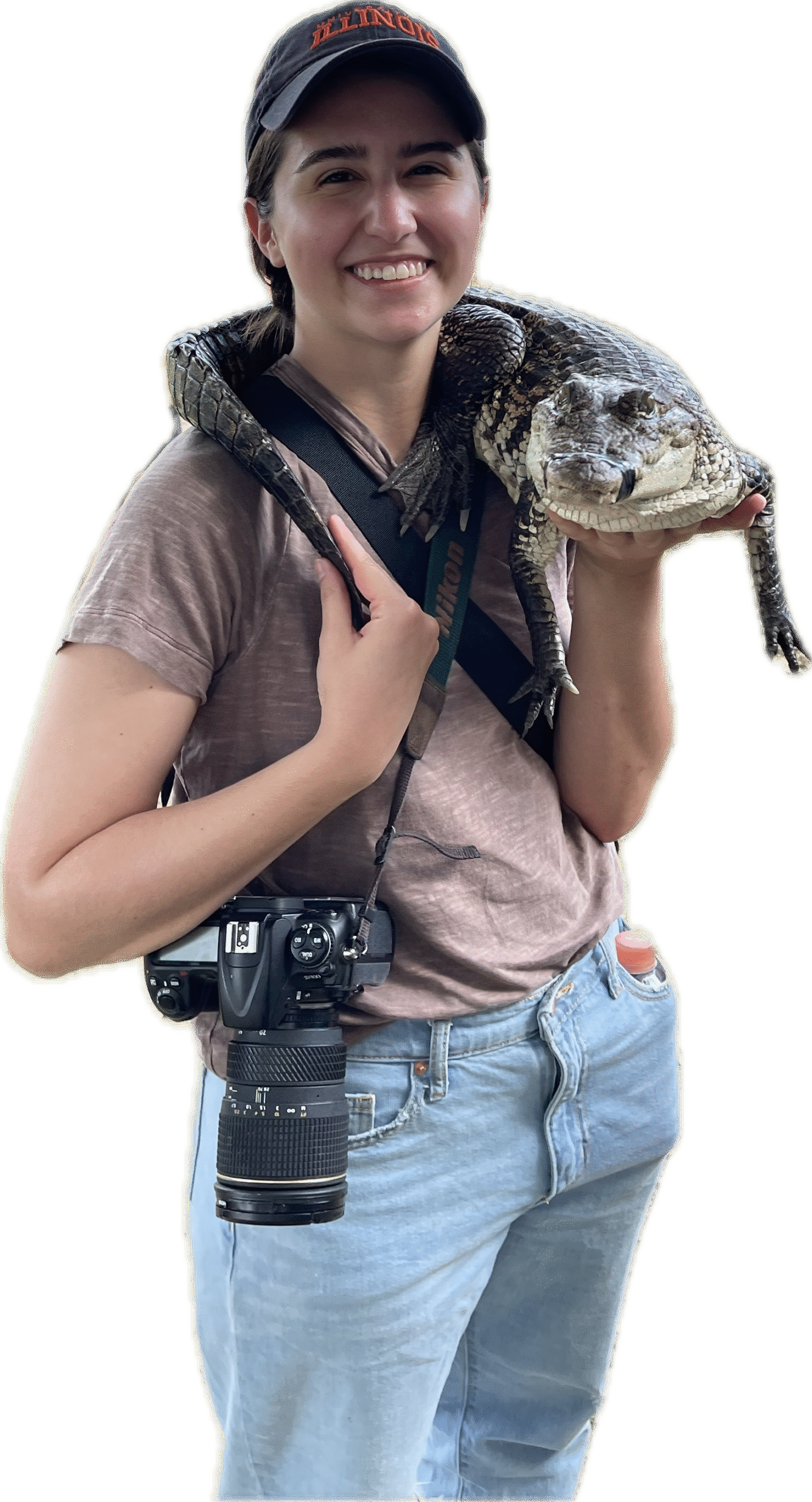 Home woman standing with a crocodile on her shoulder